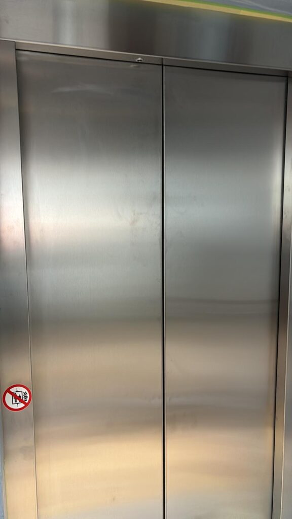 Lift doors spraying before image