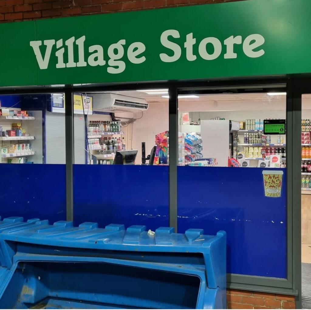 Village store window paint spraying